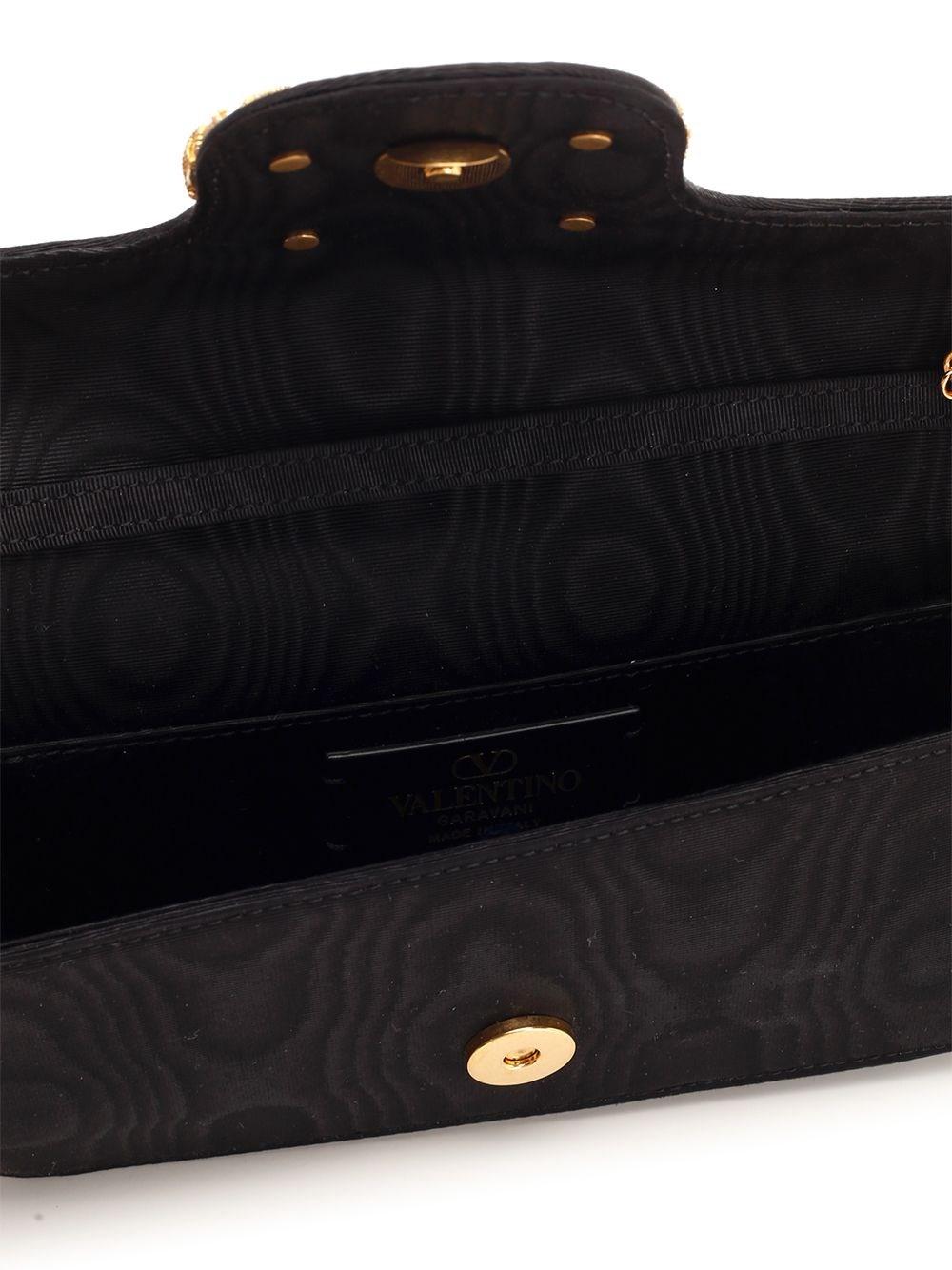 Al Duca D'Aosta Valentino Garavani Clutch "Locò" Fino al 65% di sconto